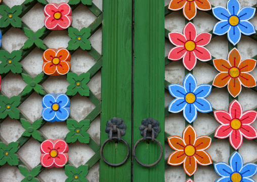 Detail of a colorful flowers on the door of Kwangbok temple, Pyongan Province, Pyongyang, North Korea