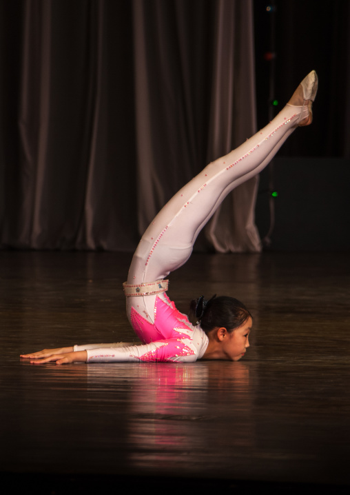 Young North Korean gymnast during a show in Mangyongdae children's palace, Pyongan Province, Pyongyang, North Korea