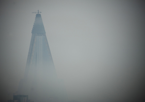 The pyramid-shaped Ryugyong hotel in the fog, Pyongan Province, Pyongyang, North Korea