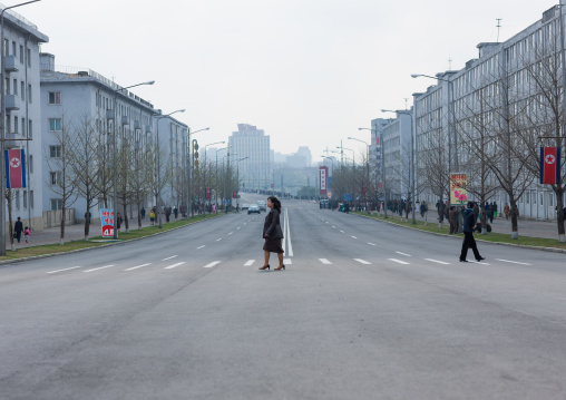 North Korean people crossing a street in town, Pyongan Province, Pyongyang, North Korea