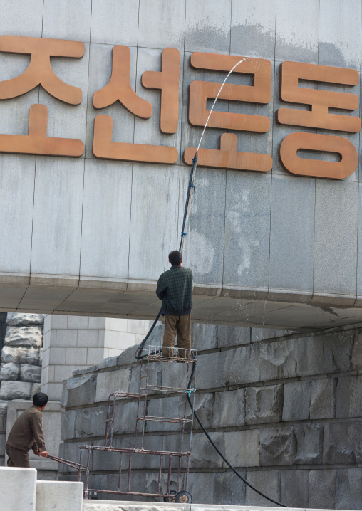 North Korean man cleaning the monument to Party founding made for the 50-year anniversary of the workers' Party of Korea, Pyongan Province, Pyongyang, North Korea