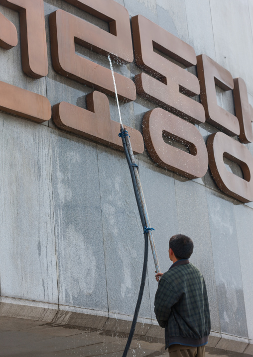 North Korean man cleaning the monument to Party founding made for the 50-year anniversary of the workers' Party of Korea, Pyongan Province, Pyongyang, North Korea