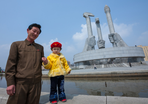 North Korean father and daughter near monument to Party founding, Pyongan Province, Pyongyang, North Korea