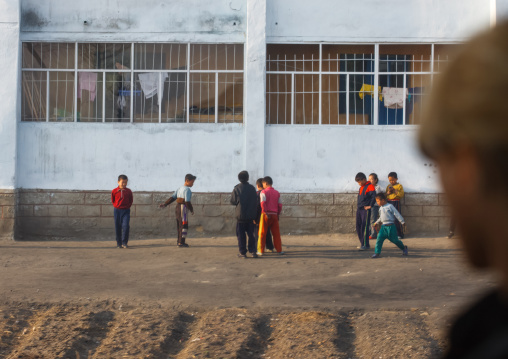 North Korean boys playing in the street, South Pyongan Province, Nampo, North Korea