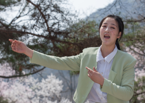 North Korean woman singing in a park, Pyongan Province, Pyongyang, North Korea