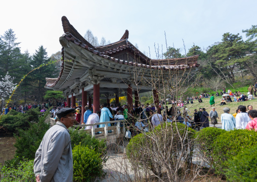 North Korean people dancing in a pavillon for the day of the sun which is the birth anniversary of Kim Il-sung, Pyongan Province, Pyongyang, North Korea