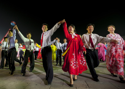 North Korean students dancing to celebrate april 15 the birth anniversary of Kim Il-sung on Kim il Sung square, Pyongan Province, Pyongyang, North Korea