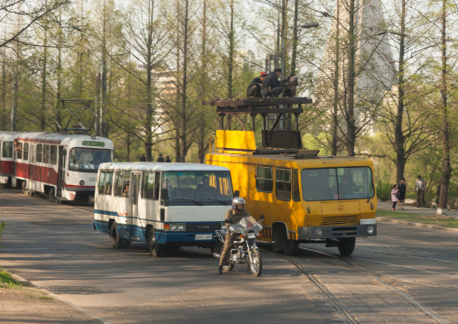 Workers repairing the electric lines for the tramway, Pyongan Province, Pyongyang, North Korea