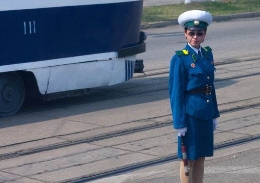 North Korean traffic security officer in blue uniform in the street, Pyongan Province, Pyongyang, North Korea