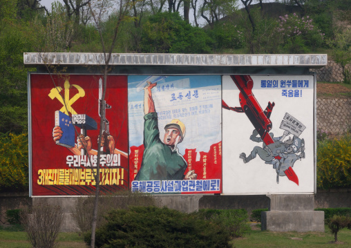 Row of North Korean propaganda billboards in the street, Pyongan Province, Pyongyang, North Korea
