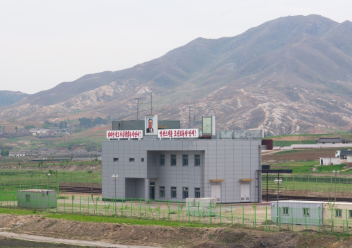 Reunification train station with a slogan about Kim Il-sung at the top, North Hwanghae Province, Kaesong, North Korea