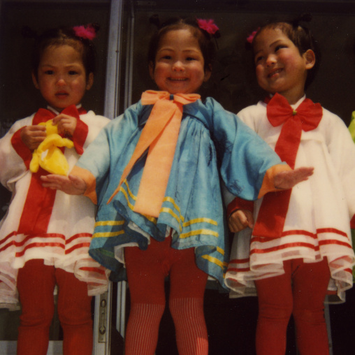 Polaroid of triplets in an orphanage, South Pyongan Province, Nampo, North Korea