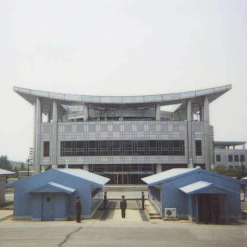 Polaroid of North Korean soldiers standing in front of the United Nations conference rooms on the demarcation line in the Demilitarized Zone, North Hwanghae Province, Panmunjom, North Korea