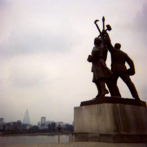 Statues at the bottom of the Juche tower built to commemorate Kim il-sung's 70th birthday, Pyongan Province, Pyongyang, North Korea