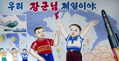 Propaganda poster depicting North Korean children celebrating a satellite launch, South Pyongan Province, Chongsan-ri Cooperative Farm, North Korea