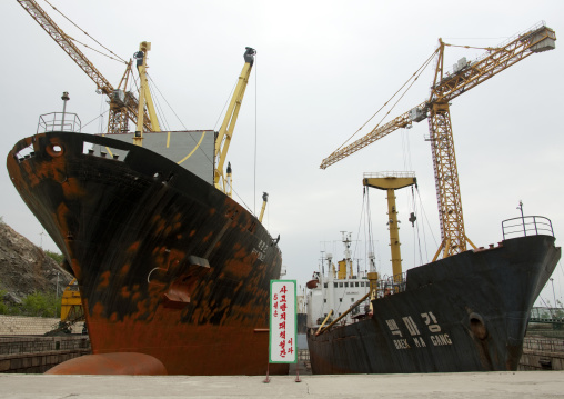 North Korean ship moored in a dock with the slogan may is the month of measures for the prevention of accidents, South Pyongan Province, Nampo, North Korea