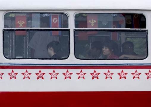 Public bus decorated with red stars one star represents 50000 km of safe driving, Pyongan Province, Pyongyang, North Korea
