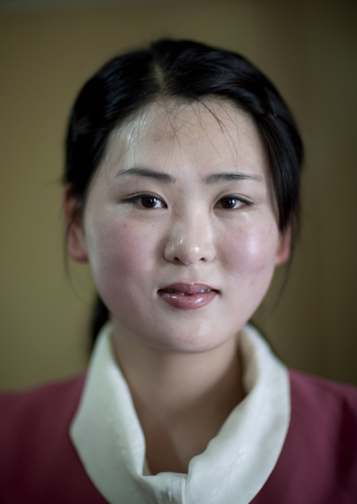 Portrait of a North Korean waitress in a restaurant, Pyongan Province, Pyongyang, North Korea