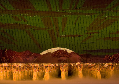 Rising sun over mount Paektu made by children pixels holding up colored boards during Arirang mass games in may day stadium, Pyongan Province, Pyongyang, North Korea