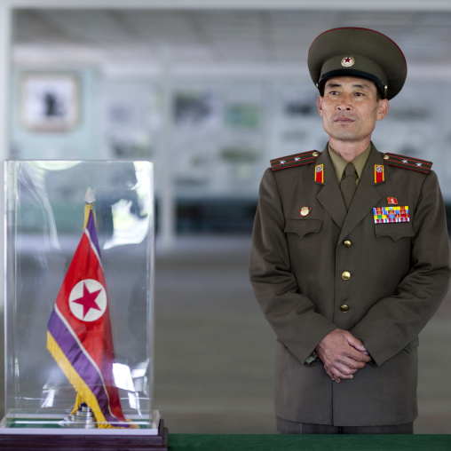 North Korean colonel in front of the armistice document in the North Korea peace museum, North Hwanghae Province, Panmunjom, North Korea