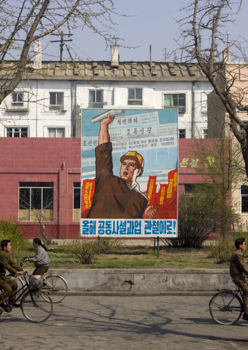 Propaganda billboard in the street with a North Korean worker, South Pyongan Province, Nampo, North Korea