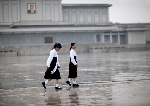 North Korean girls under the rain in Kumsusan palace of the sun that serves as the mausoleum for Kim Il-sung and Kim Jong-il, Pyongan Province, Pyongyang, North Korea