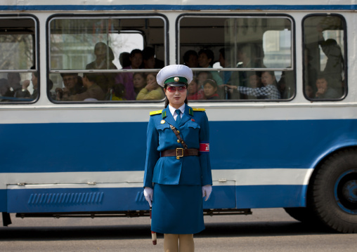 North Korean traffic security officer in blue uniform in the street, Pyongan Province, Pyongyang, North Korea