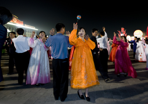 North Korean students dancing to celebrate april 15 the birth anniversary of Kim Il-sung on Kim il Sung square, Pyongan Province, Pyongyang, North Korea