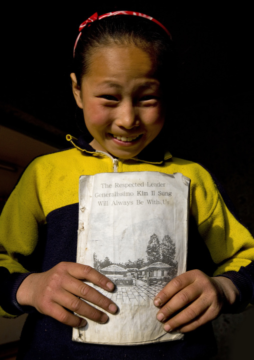North Korean girl holding an english class book, Kangwon Province, Chonsam Cooperative Farm, North Korea
