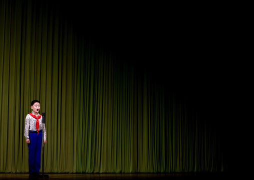 North Korean boy on the stage of Mangyongdae children's palace, Pyongan Province, Pyongyang, North Korea