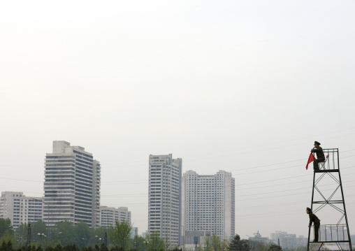 North Korean officers monitoring an army parade on a high chair, Pyongan Province, Pyongyang, North Korea