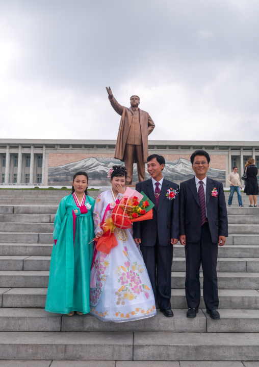 North Korean couples celebrating their weddings in front of Kim il Sung statue in Mansudae Grand monument, Pyongan Province, Pyongyang, North Korea