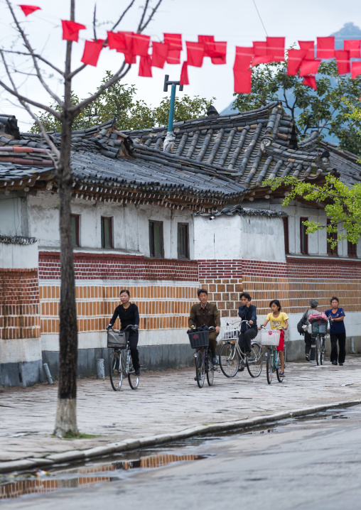 North Korean people with bicycles in the old streets, North Hwanghae Province, Kaesong, North Korea
