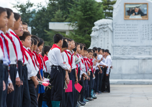 North Korean pioneers paying respect to the Leaders in Mansudae art studio, Pyongan Province, Pyongyang, North Korea
