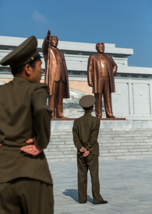 North Korean soldiers in front of the statues of the Dear Leaders in Mansudae Grand monument, Pyongan Province, Pyongyang, North Korea
