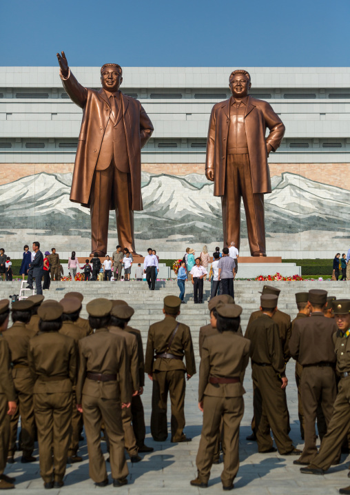 North Korean soldiers in front of the statues of the Dear Leaders in Mansudae Grand monument, Pyongan Province, Pyongyang, North Korea