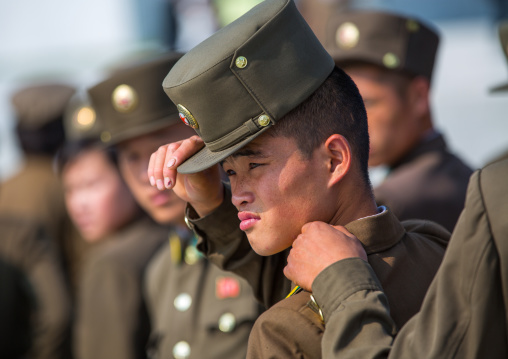 North Korean soldier putting his kepi, Pyongan Province, Pyongyang, North Korea
