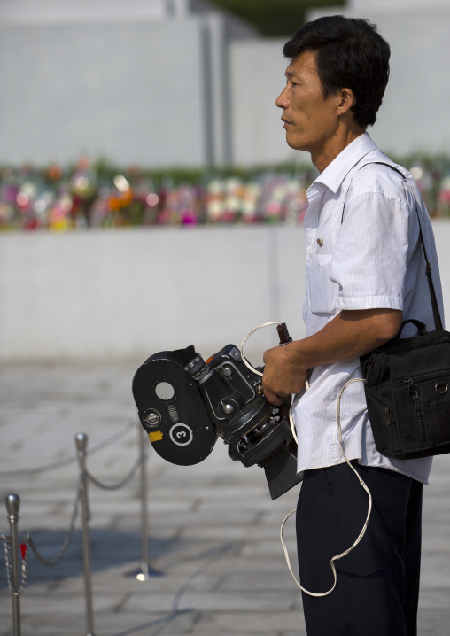 North Korean cameraman with a film camera, Pyongan Province, Pyongyang, North Korea