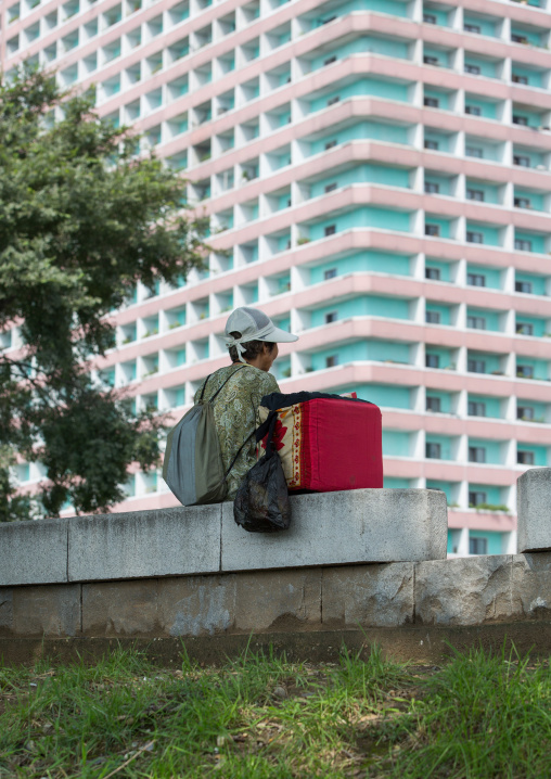 Woman selling ice cream having a rest, Pyongan Province, Pyongyang, North Korea