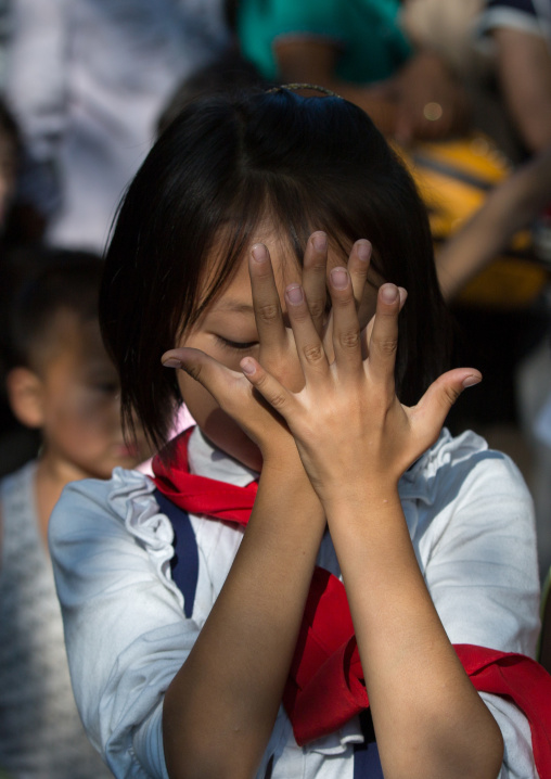 North Korean girl dancing in a park on september 9 day of the foundation of the republic, Pyongan Province, Pyongyang, North Korea