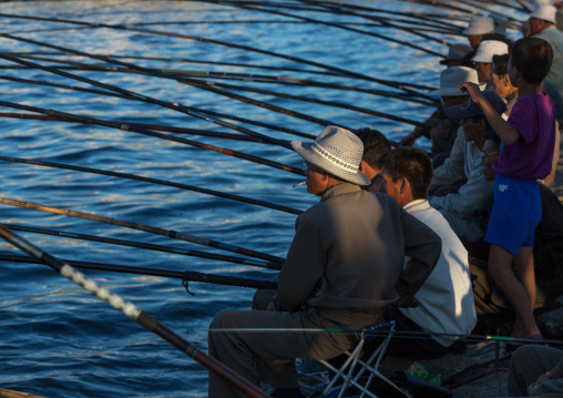 North Korean men fishing in the port, Kangwon Province, Wonsan, North Korea
