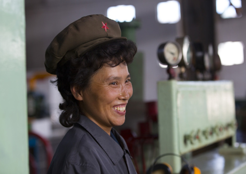 Smiling North Korean worker woman at Hungnam nitrogen fertilizer plant, South Hamgyong Province, Hamhung, North Korea