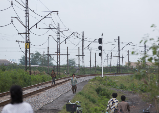 North Korea people walking on an empty railway, South Hamgyong Province, Hamhung, North Korea