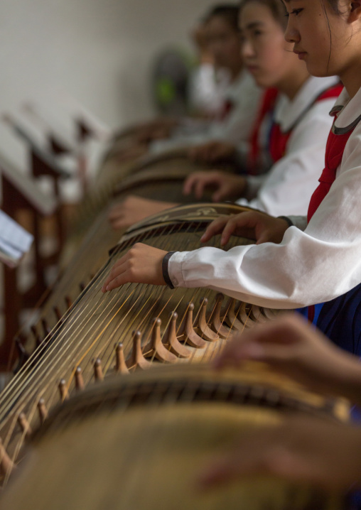 North Korean girls playing kayagum in Mangyongdae schoolchildren's palace, Pyongan Province, Pyongyang, North Korea