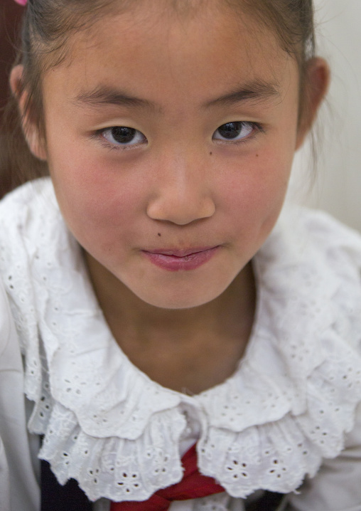 Portrait of a North Korean girl in Mangyongdae children's palace, Pyongan Province, Pyongyang, North Korea