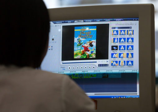 North Korean woman working on a computer for an editing classroom in Mangyongdae children's palace, Pyongan Province, Pyongyang, North Korea