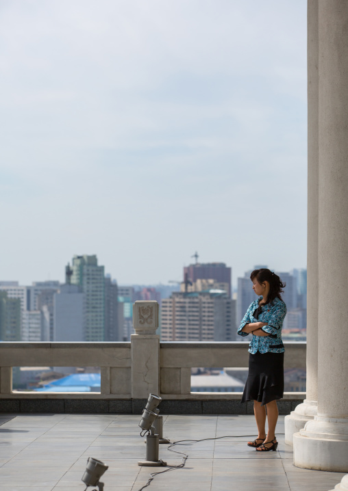 North Korean woman on the terrace of the Grand people's study house, Pyongan Province, Pyongyang, North Korea