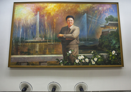 Fans cooling a Kim Jong il portrait in front of the Juche tower at the Grand people's study house, Pyongan Province, Pyongyang, North Korea