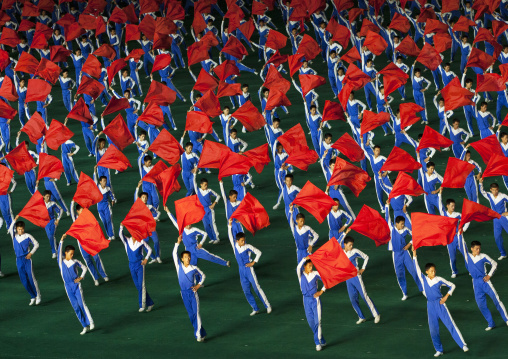 North Korean gymnasts with red flags during the Arirang mass games in may day stadium, Pyongan Province, Pyongyang, North Korea
