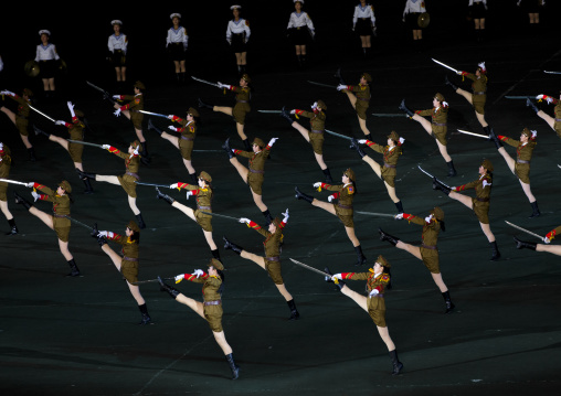 Sexy North Korean women dressed as soldiers dancing with swords during the Arirang mass games in may day stadium, Pyongan Province, Pyongyang, North Korea